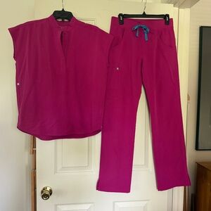 igs Raspberry I think is the color Rafaela oversized scrub top XS and Kade Scrub